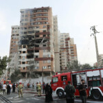 Firefighters work at the scene of a damaged building in the aftermath of Israeli strikes, in Tehran, Iran, June 13, 2025. Majid Asgaripour/WANA (West Asia News Agency) via REUTERS
