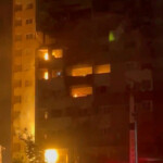 Fire burns in a building damaged in an Israeli strike in Tehran, Iran in this screengrab obtained from a social media video released on July 13, 2025. Social Media/via REUTERS
