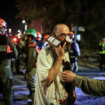 Rescue and security personnel attend a wounded person at an impact site following missile attack from Iran on Israel, in Ramat Gan, Israel June 13, 2025 REUTERS/Itai Ron