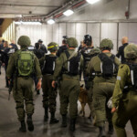 Security and rescue personnel take cover in public shelter following missile attack from Iran on Israel, at Tel Aviv, Israel June 13, 2025 REUTERS/Itay Cohen