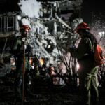Rescue and security personnel work at an impact site following missile attack from Iran on Israel, in Ramat Gan, Israel June 13, 2025 REUTERS/Itai Ron