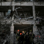 Rescue personnel work at an impact site following missile attack from Iran on Israel, in Ramat Gan June 13, 2025 REUTERS/Itai Ron