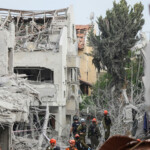 Rescue personnel work at an impact site following missile attack from Iran on Israel, in Rishon LeZion, Israel, June 14, 2025. REUTERS/Ronen Zvulun