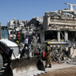 A rescue personnel works at an impact site following missile attack from Iran on Israel, in Rishon LeZion, Israel, June 14, 2025. REUTERS/Ronen Zvulun
