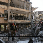 Rescue personnel work at an impact site following missile attack from Iran on Israel, in Ramat Gan, Israel, June 14, 2025. REUTERS/Ronen Zvulun