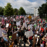 People participate in the "No Kings" rally near the Georgia State Capitol in Atlanta, Georgia, U.S., June 14, 2025. REUTERS/Alyssa Pointer