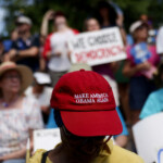 A person wears a hat that reads: "Make America Obama Again", as people participate in the "No Kings" rally near the Georgia State Capitol in Atlanta, Georgia, U.S., June 14, 2025. REUTERS/Alyssa Pointer