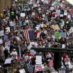 People gather on the day of the "No Kings" rally in Atlanta, Georgia, U.S., June 14, 2025. REUTERS/Alyssa Pointer