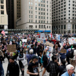 People convene for the start of the "No Kings" rally at the Daley Plaza in downtown Chicago, Illinois, U.S., June 14, 2025. REUTERS/Octavio Jones