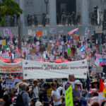 LA County Sheriffs stand guard as demonstrators attend a "No Kings Day" protest outside City Hall, in downtown Los Angeles, California, U.S., June 14, 2025. REUTERS/MIKE BLAKE