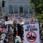 LA County Sheriffs stand guard as demonstrators attend a "No Kings Day" protest against President Donald Trump's policies outside City Hall, in downtown Los Angeles, California, U.S., June 14, 2025. REUTERS/MIKE BLAKE