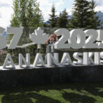A worker prepares a sign ahead of the G7 summit at a satellite location in Banff, Alberta, Canada, June 14, 2025. REUTERS/Amber Bracken