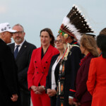 U.S. President Donald Trump is greeted by Tsuut'ina Minor Chief Steven Crowchild, Treaty 7 Representative, upon arrival to attend the G7 Leaders' Summit in the Rocky Mountain resort town of Kananaskis, at Calgary International Airport in Calgary, Alberta, Canada, June 15, 2025. REUTERS/Kevin Lamarque