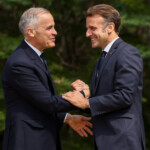 Canada's Prime Minister Mark Carney welcomes France's President Emmanuel Macron,as he arrives for the G7 Leaders' Summit in Kananaskis, Alberta, Canada, June 16, 2025. REUTERS/Chris Helgren/Pool