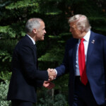 Canada's Prime Minister Mark Carney welcomes U.S. President Donald Trump,as he arrives for the G7 Leaders' Summit in Kananaskis, Alberta, Canada, June 16, 2025. REUTERS/Chris Helgren/Pool