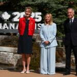 Canada's Prime Minister Mark Carney and his wife Diana Fox Carney stand next to Italy's Prime Minister Giorgia Meloni, as she arrives for the G7 Leaders' Summit in Kananaskis, Alberta, Canada, June 16, 2025. REUTERS/Chris Helgren/Pool
