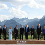 European Council President Antonio Costa, Japan's Prime Minister Shigeru Ishiba, Italian Prime Minister Giorgia Meloni, French President Emmanuel Macron, Canada's Prime Minister Mark Carney, U.S. President Donald Trump, British Prime Minister Keir Starmer, German Chancellor Friedrich Merz and European Commission President Ursula von der Leyen pose for a family photo during the G7 Summit, in Kananaskis, Alberta, Canada, June 16, 2025. REUTERS/Suzanne Plunkett/Pool