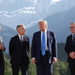 French President Emmanuel Macron, Canada's Prime Minister Mark Carney, U.S. President Donald Trump, and British Prime Minister Keir Starmer, prepare for a family photo during the G7 Summit, in Kananaskis, Alberta, Canada, June 16, 2025. REUTERS/Suzanne Plunkett/Pool