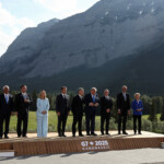 European Council President Antonio Costa, Japan's Prime Minister Shigeru Ishiba, Italian Prime Minister Giorgia Meloni, French President Emmanuel Macron, Canada's Prime Minister Mark Carney, U.S. President Donald Trump, British Prime Minister Keir Starmer, German Chancellor Friedrich Merz and European Commission President Ursula von der Leyen pose for a family photo during the G7 Summit in Kananaskis, Alberta, Canada, June 16, 2025. REUTERS/Kevin Lamarque