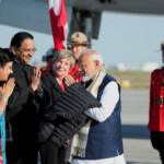India's Prime Minister Narendra Modi is greeted, as he arrives for the G7 Leaders' Summit held at the Rocky Mountain resort village of Kananaskis, at Calgary International Airport in Calgary, Alberta, Canada, June 16, 2025. REUTERS/Todd Korol/Pool