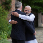 Indian Prime Minister Narendra Modi hugs Britain's Prime Minister Keir Starmer as he arrives at Chequers near Aylesbury, England, Thursday, July 24, 2025. Kin Cheung/Pool via REUTERS