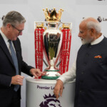 Britain's Prime Minister Keir Starmer and Prime Minister Narendra Modi of India, look at a Premier League trophy during a business showcase event at Chequers near Aylesbury, England, Thursday, July 24, 2025. Kin Cheung/Pool via REUTERS