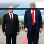 U.S. President Donald Trump stands with Russian President Vladimir Putin, as they meet to negotiate for an end to the war in Ukraine, at Joint Base Elmendorf-Richardson in Anchorage, Alaska, U.S., August 15, 2025. REUTERS/Kevin Lamarque