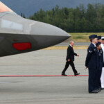 Russian President Vladimir Putin walks towards U.S. President Donald Trump (not pictured), as they meet to discuss an end to the war in Ukraine, at Joint Base Elmendorf-Richardson, in Anchorage, Alaska, U.S., August 15, 2025. REUTERS/Kevin Lamarque
