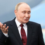 Russian President Vladimir Putin reacts, as he meets with U.S. President Donald Trump to negotiate for an end to the war in Ukraine, at Joint Base Elmendorf-Richardson in Anchorage, Alaska, U.S., August 15, 2025. REUTERS/Kevin Lamarque