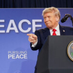 U.S. President Donald Trump points a finger as he and Russian President Vladimir Putin (not pictured) hold a press conference following their meeting to negotiate an end to the war in Ukraine, at Joint Base Elmendorf-Richardson, in Anchorage, Alaska, U.S., August 15, 2025. REUTERS/Kevin Lamarque