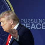 U.S. President Donald Trump gestures as he walks off stage following a press conference with Russian President Vladimir Putin following their meeting to negotiate an end to the war in Ukraine, at Joint Base Elmendorf-Richardson in Anchorage, Alaska, U.S., August 15, 2025. REUTERS/Jeenah Moon