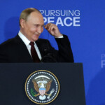 Russian President Vladimir Putin reacts as he holds a press conference with U.S. President Donald Trump following their meeting to negotiate an end to the war in Ukraine, at Joint Base Elmendorf-Richardson in Anchorage, Alaska, U.S., August 15, 2025. REUTERS/Jeenah Moon