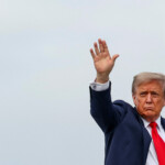 U.S. President Donald Trump waves as he boards Air Force One upon departure following his meeting with Russian President Vladimir Putin to negotiate an end to the war in Ukraine, at Joint Base Elmendorf-Richardson, Alaska, U.S., August 15, 2025. REUTERS/Kevin Lamarque
