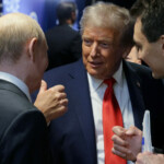 U.S. President Donald Trump talks to Russian President Vladimir Putin after a joint news conference following their meeting at Joint Base Elmendorf-Richardson in Anchorage, Alaska, U.S., August 15, 2025. Sputnik/Gavriil Grigorov/Pool via REUTERS