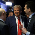 U.S. President Donald Trump talks to Russian President Vladimir Putin after a joint news conference following their meeting at Joint Base Elmendorf-Richardson in Anchorage, Alaska, U.S., August 15, 2025. Sputnik/Gavriil Grigorov/Pool via REUTERS