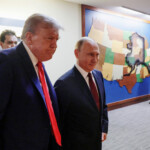 U.S. President Donald Trump and Russian President Vladimir Putin walk to a joint news conference following their meeting at Joint Base Elmendorf-Richardson in Anchorage, Alaska, U.S., August 15, 2025. Sputnik/Gavriil Grigorov/Pool via REUTERS ATTENTION EDITORS - THIS IMAGE WAS PROVIDED BY A THIRD PARTY.