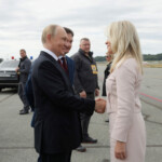 Russian President Vladimir Putin shakes hands with Chief of Protocol of the United States Monica Crowley upon departure following his meeting with U.S. President Donald Trump in Anchorage, Alaska, U.S., August 15, 2025. Sputnik/Gavriil Grigorov/Pool via REUTERS