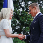 U.S. Chief of Protocol Monica Crowley greets Finland's President Alexander Stubb as he arrives at the White House amid negotiations to end the Russian war in Ukraine, in Washington, D.C., U.S., August 18, 2025. REUTERS/Nathan Howard