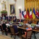 Ukrainian President Volodymyr Zelenskiy speaks during a meeting with U.S. President Donald Trump, German Chancellor Friedrich Merz, French President Emmanuel Macron, British Prime Minister Keir Starmer, Italian Prime Minister Giorgia Meloni, Finland's President Alexander Stubb, NATO Secretary General Mark Rutte and European Commission President Ursula von der Leyen amid negotiations to end the Russian war in Ukraine, at the White House in Washington, D.C., U.S., August 18, 2025. REUTERS/Alexander Drago