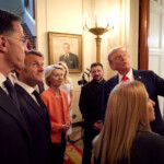U.S. President Donald Trump, Ukrainian President Volodymyr Zelenskiy, French President Emmanuel Macron, Italian Prime Minister Giorgia Meloni, European Commission President Ursula von der Leyen, NATO Secretary General Mark Rutte walk during a meeting, amid negotiations to end the Russian war in Ukraine, at the White House in Washington, D.C., U.S., August 18, 2025. Ukrainian Presidential Press Service/Handout via REUTERS