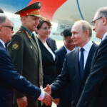 Russian President Vladimir Putin shakes hands with officials during a welcoming ceremony at an airport upon his arrival for the Shanghai Cooperation Organisation (SCO) summit in Tianjin, China August 31, 2025. Sputnik/Vladimir Smirnov/Pool via REUTERS ATTENTION EDITORS - THIS IMAGE WAS PROVIDED BY A THIRD PARTY.