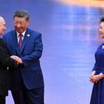 Chinese President Xi Jinping and his wife Peng Liyuan welcome Russian President Vladimir Putin during a ceremony at the Shanghai Cooperation Organisation (SCO) summit in Tianjin, China August 31, 2025. Sputnik/Sergei Bobylyov/Pool via REUTERS ATTENTION EDITORS - THIS IMAGE WAS PROVIDED BY A THIRD PARTY.
