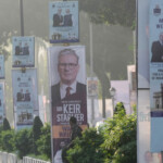 Posters welcoming British Prime Minister Keir Starmer line a street in Mumbai during his visit to India, in Mumbai, India, October 8, 2025. Stefan Rousseau/Pool via REUTERS