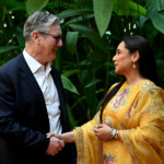 British Prime Minister Keir Starmer shakes hands with actor Rani Mukerji during a visit to Yash Raj Films in Mumbai, India, October 8, 2025. Leon Neal/Pool via REUTERS