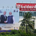 A billboard of Indian Prime Minister Narendra Modi welcoming British Prime Minister Keir Starmer is displayed along a street, in Mumbai, India, October 8, 2025. Leon Neal/Pool via REUTERS
