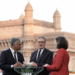 British Prime Minister Keir Starmer speaks to British Deputy High Commissioner for Western India Harjinder Kang and British High Commissioner to India, Lindy Cameron, on a rooftop in front of the Gateway of India on October 8, 2025 in Mumbai, India. Stefan Rousseau/Pool via REUTERS