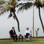 British Prime Minister Sir Keir Starmer and Indian Prime Minister Narendra Modi interact at Raj Bhavan, in Mumbai, India October 9, 2025. Stefan Rousseau/Pool via REUTERS