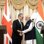 British Prime Minister Sir Keir Starmer and the Prime Minister of India, Narendra Modi, shake hands after delivering a statement to the press at Raj Bhavan, in Mumbai, India October 9, 2025. Stefan Rousseau/Pool via REUTERS