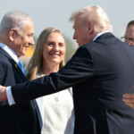 Israeli Prime Minister Benjamin Netanyahu welcomes U.S. President Donald Trump at Ben Gurion International Airport, amid a U.S.-brokered prisoner-hostage swap and ceasefire deal between Israel and Hamas, in Lod, Israel, October 13, 2025. REUTERS/Evelyn Hockstein