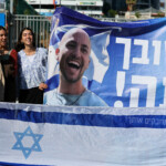 People gather while waiting for the arrival of hostages, who were kidnapped during the deadly October 7, 2023 attack by Hamas and taken to Gaza, as they are released as part of a hostages-prisoners swap and a ceasefire deal in Gaza between Hamas and Israel, at the site of Beilinson Schneider complex, in Petah Tikva, Israel October 13, 2025. REUTERS/Stoyan Nenov